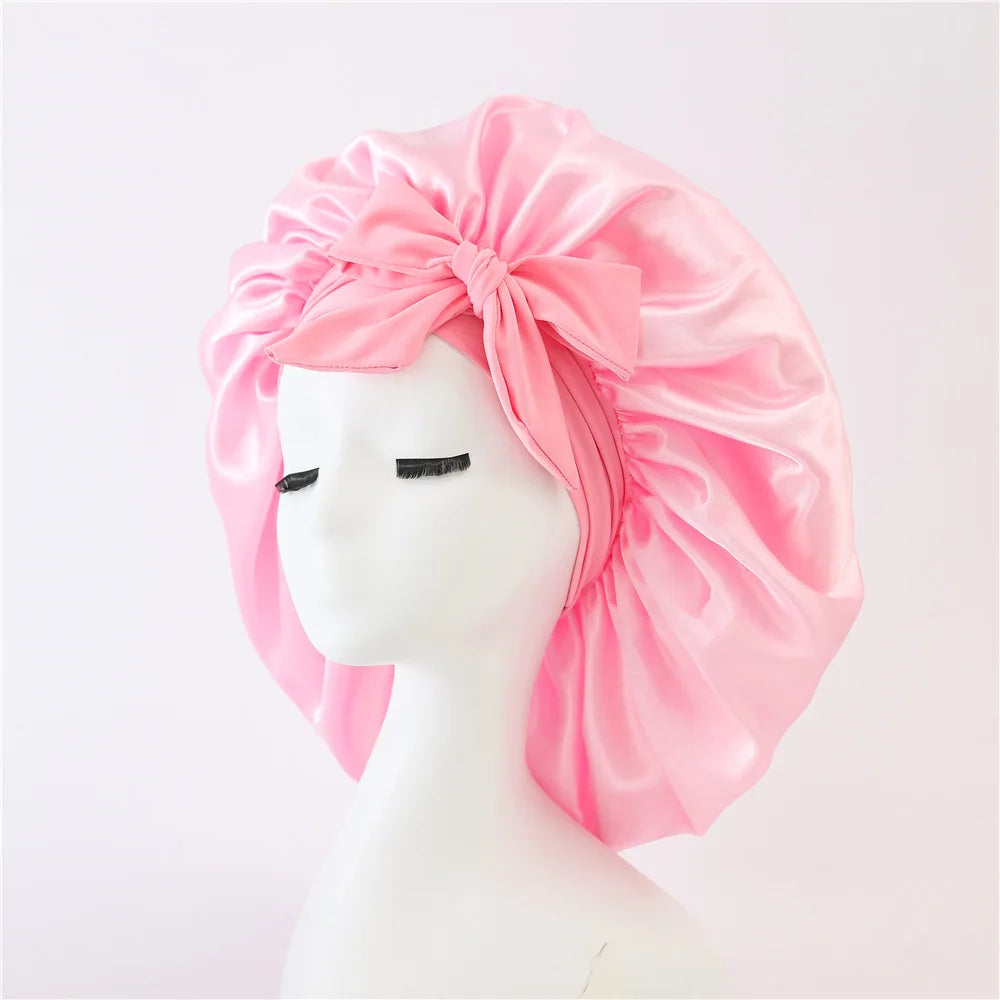 Bonnet de sommeil pour femmes en satin uni, bande élastique extensible avec lien, bonnet de douche de nuit ajustable pour protéger les cheveux.